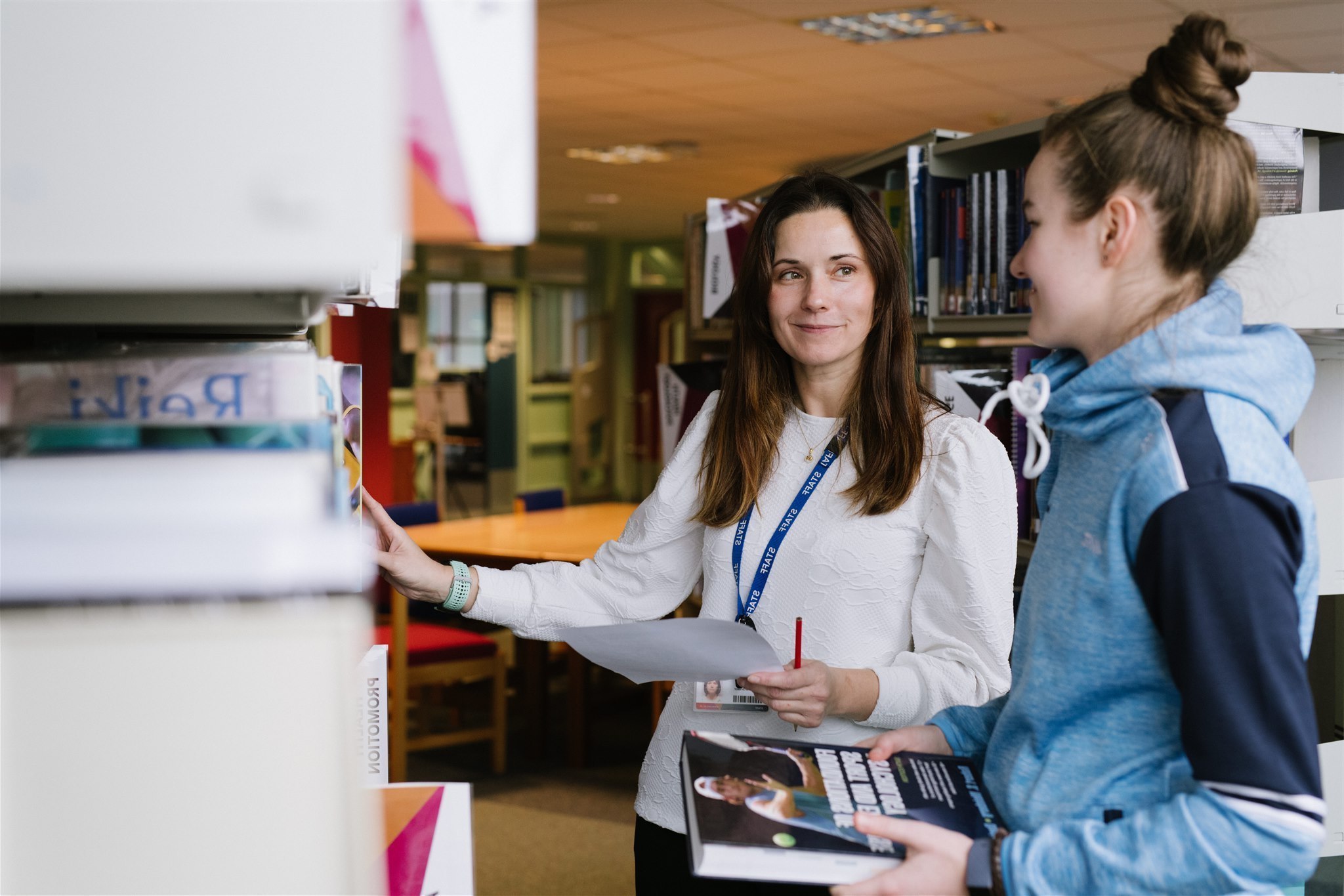 LRC Coordinator with student in resource centre