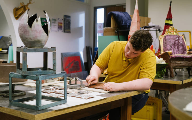 Student working in college art studio