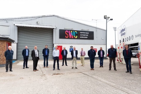 South West College Automotive department staff standing outside SWC's Gortin Road Automotive Workshop